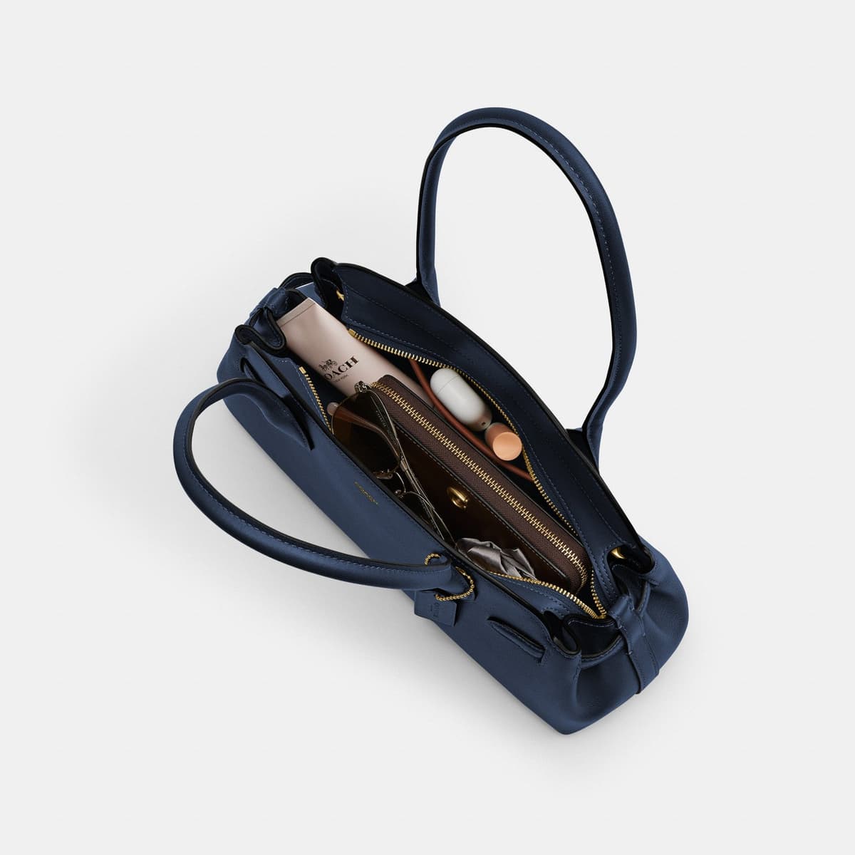 Coach Empire Carryall Bag in Brass_Navy - Front view on Eldaly - Thumbnail 4