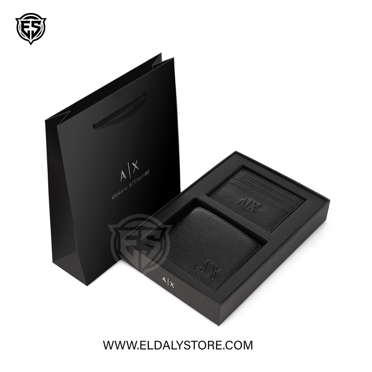 Armani Exchange A|X boxed set for men with wine-colored packaging, including accessories and grooming products in a neatly arranged display.